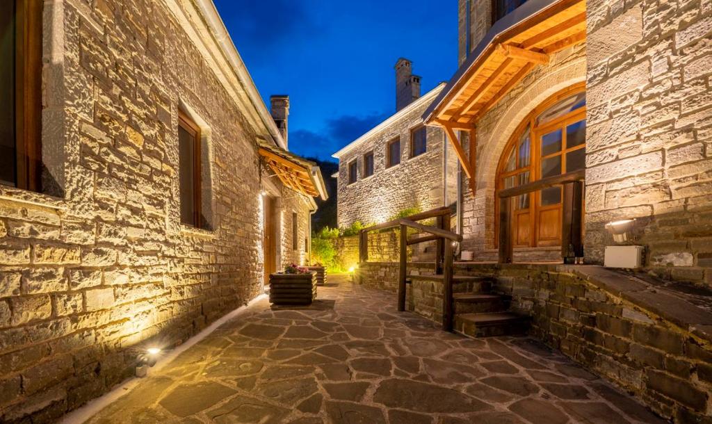 an alley in an old building at night at Kipi Mountain Resort in Kipoi