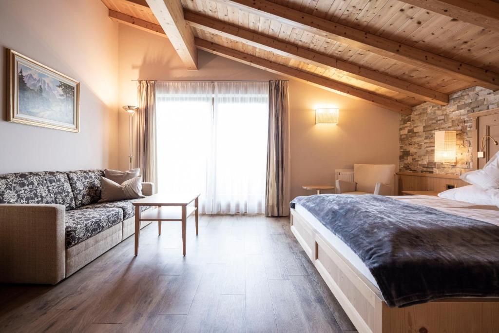 Postel nebo postele na pokoji v ubytování Hotel Baumwirt