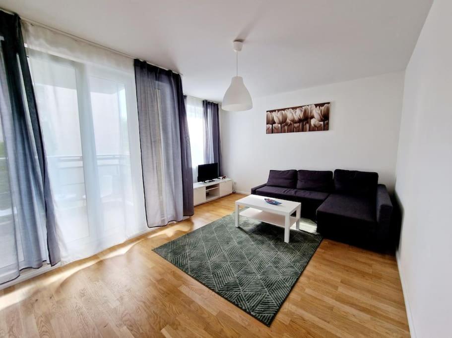 a living room with a couch and a table at Apartment in the heart of Berlin 2122 in Berlin