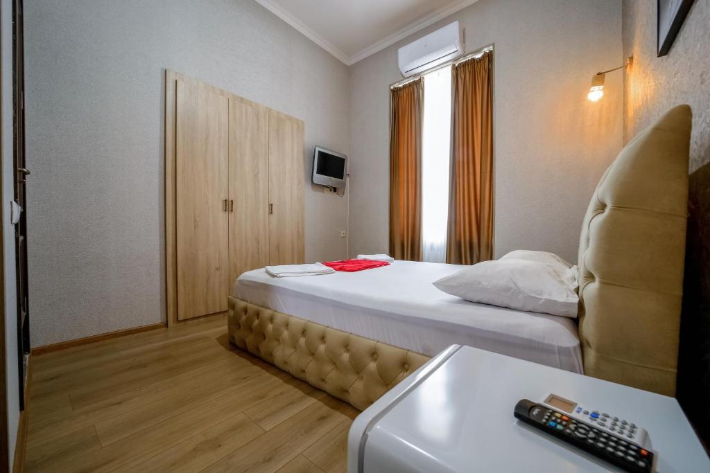 Postel nebo postele na pokoji v ubytování Hotel Guri