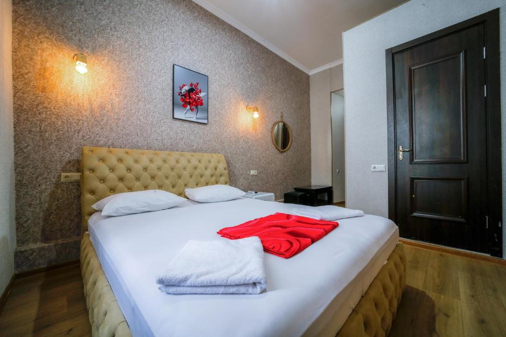 Postel nebo postele na pokoji v ubytování Hotel Guri