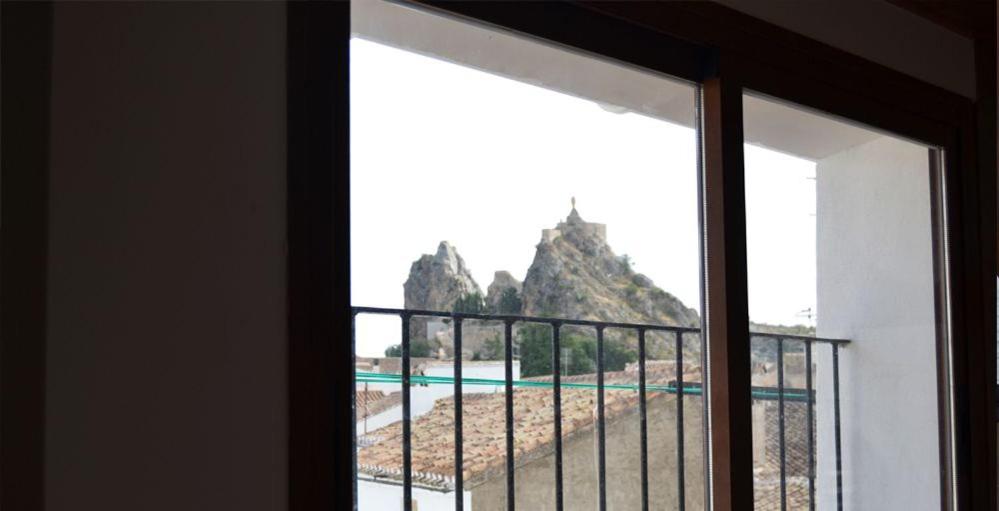 a window with a view of a mountain at Casa Corralazos in Castril