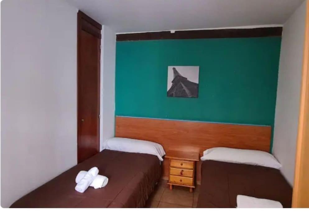 Postel nebo postele na pokoji v ubytování Corrala de San Antón. Sencillo apartamento en pleno centro