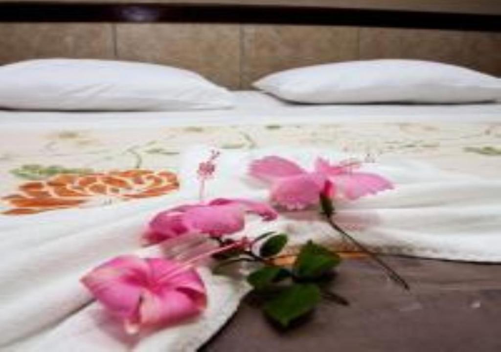 Uma cama ou camas num quarto em Hotel Chale Nosso Sítio