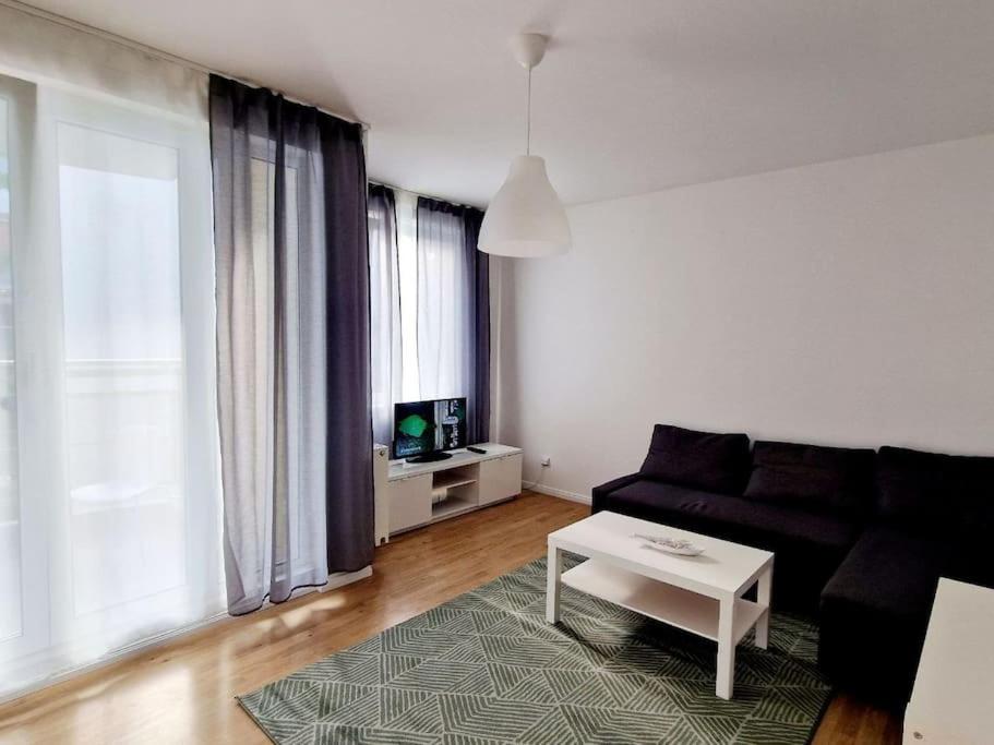 a living room with a couch and a coffee table at Charming apartment in the center of Berlin 2142 in Berlin
