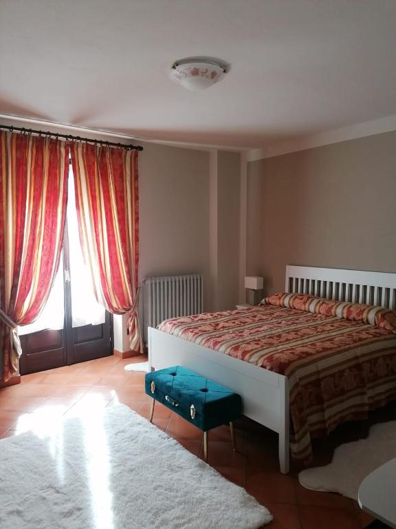 Łóżko lub łóżka w pokoju w obiekcie LA CASA DI TALIN