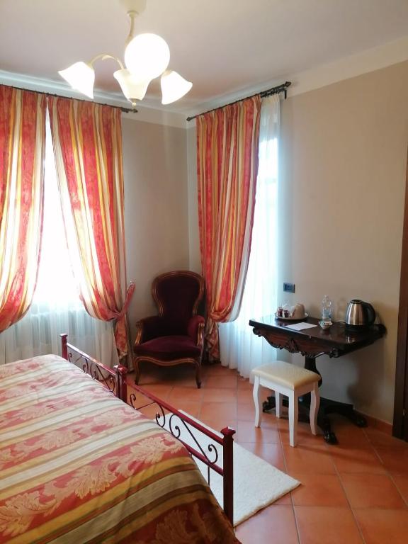 Łóżko lub łóżka w pokoju w obiekcie LA CASA DI TALIN