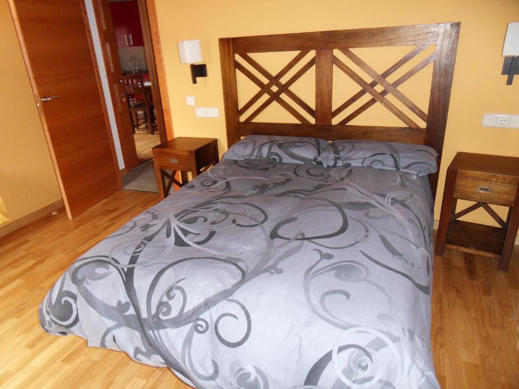 Postel nebo postele na pokoji v ubytování Pensió i Apartaments la Bordeta