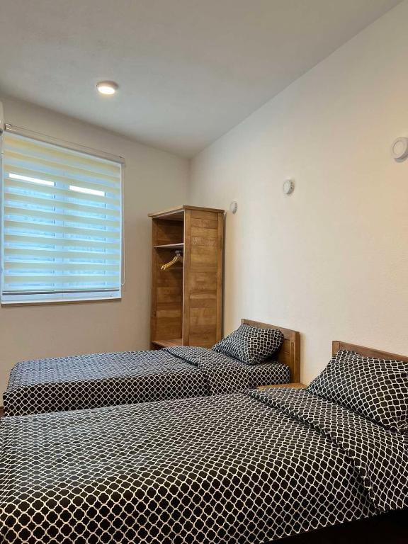 Postel nebo postele na pokoji v ubytování Rooms & Spa BJELASICA