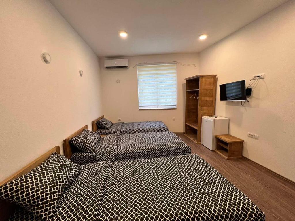 Postel nebo postele na pokoji v ubytování Rooms & Spa BJELASICA