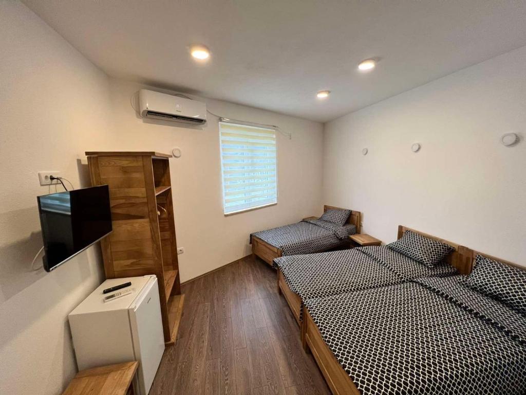 TV a/nebo společenská místnost v ubytování Rooms & Spa BJELASICA