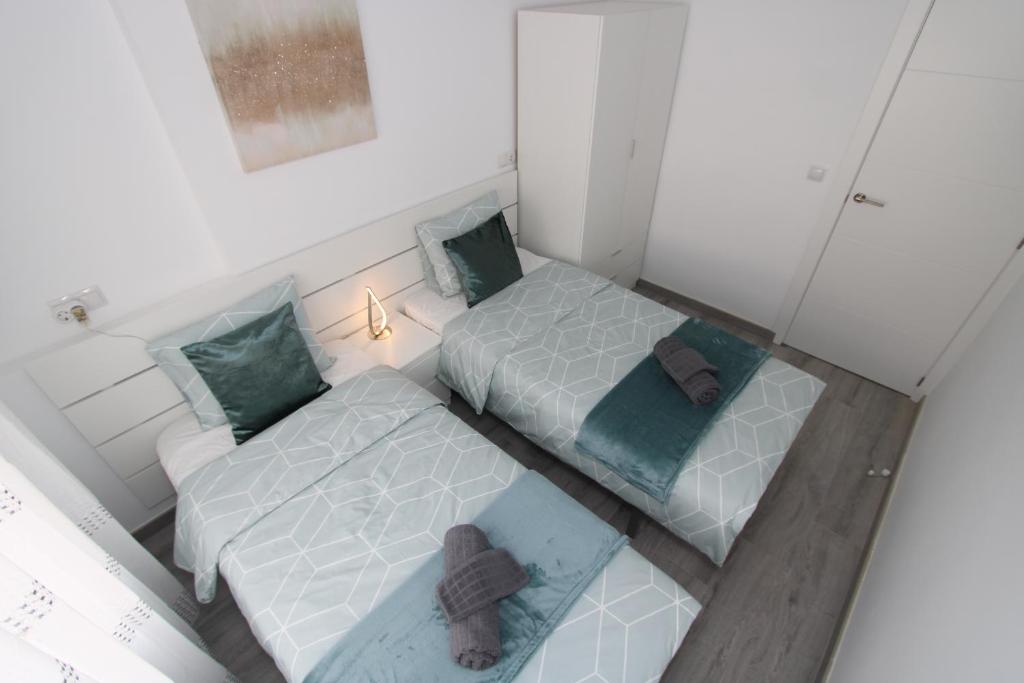 Postel nebo postele na pokoji v ubytování San Rafael Apartment Los Boliches