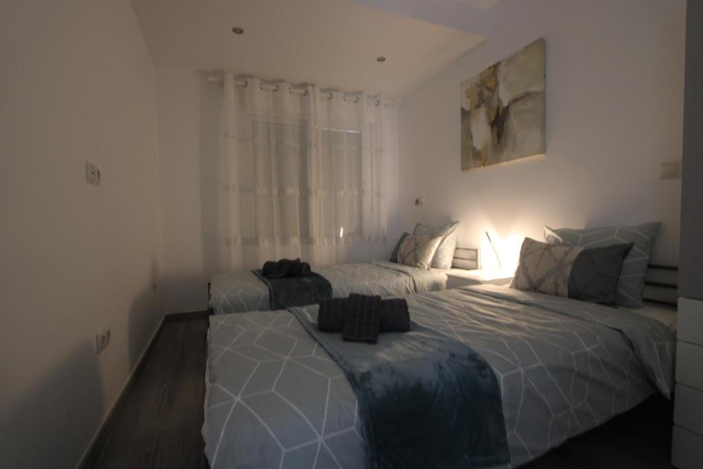 Postel nebo postele na pokoji v ubytování San Rafael Apartment Los Boliches