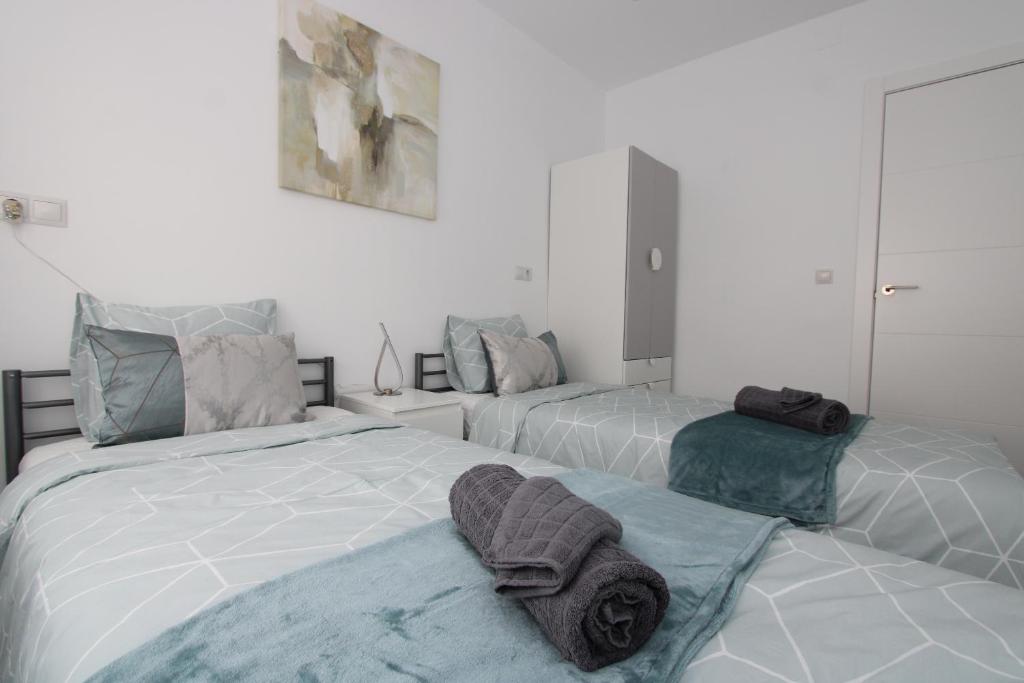 Postel nebo postele na pokoji v ubytování San Rafael Apartment Los Boliches