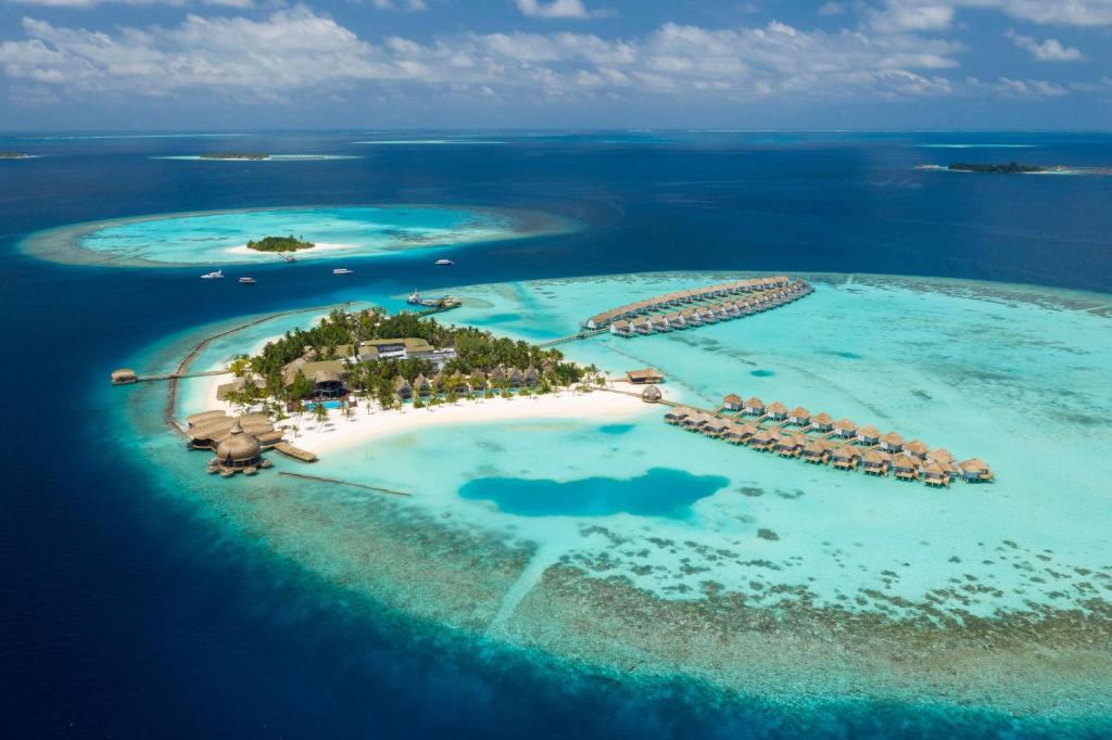 an aerial view of an island in the ocean at Outrigger Maldives Maafushivaru Resort in Dhangethi