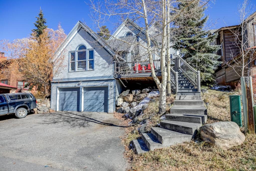 a house with a staircase leading up to a garage at Just Walk Inn Townhome: Stroll To Main St, Gondola in Breckenridge