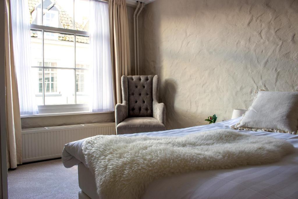 Postel nebo postele na pokoji v ubytování Boutique Hotel Elburg met Tapperij