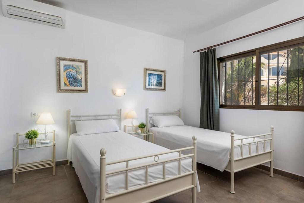 Postel nebo postele na pokoji v ubytování Villa Jaconne - PlusHolidays