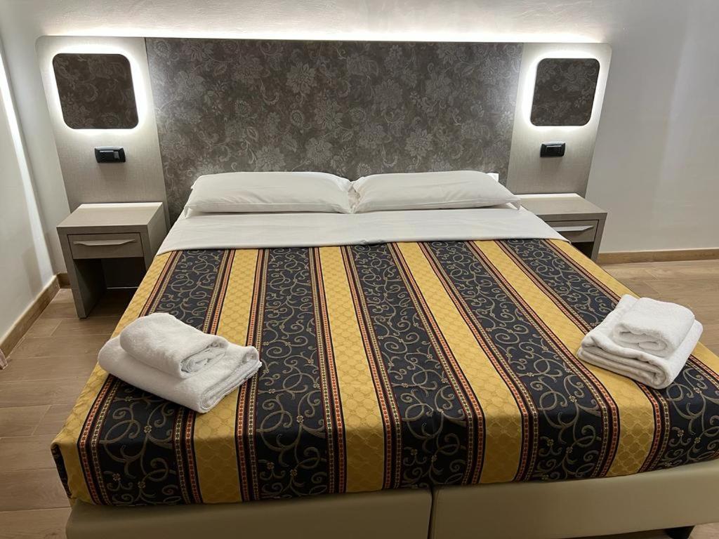 Postel nebo postele na pokoji v ubytování Hotel principe