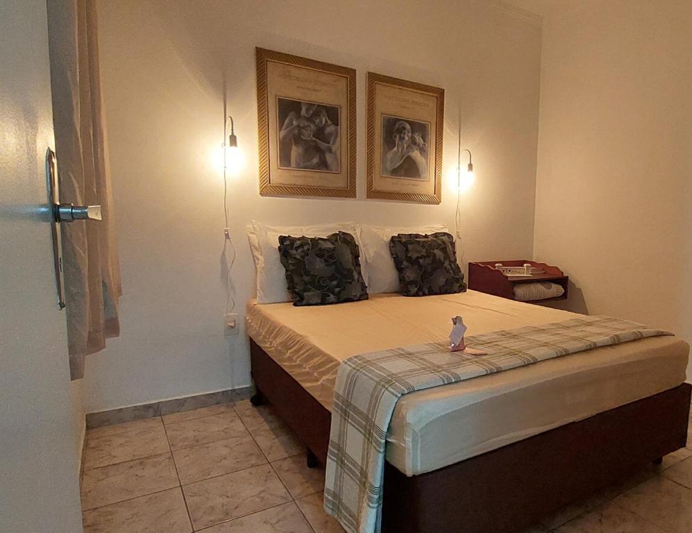 מיטה או מיטות בחדר ב-Rota 013 - Santos Canal 4