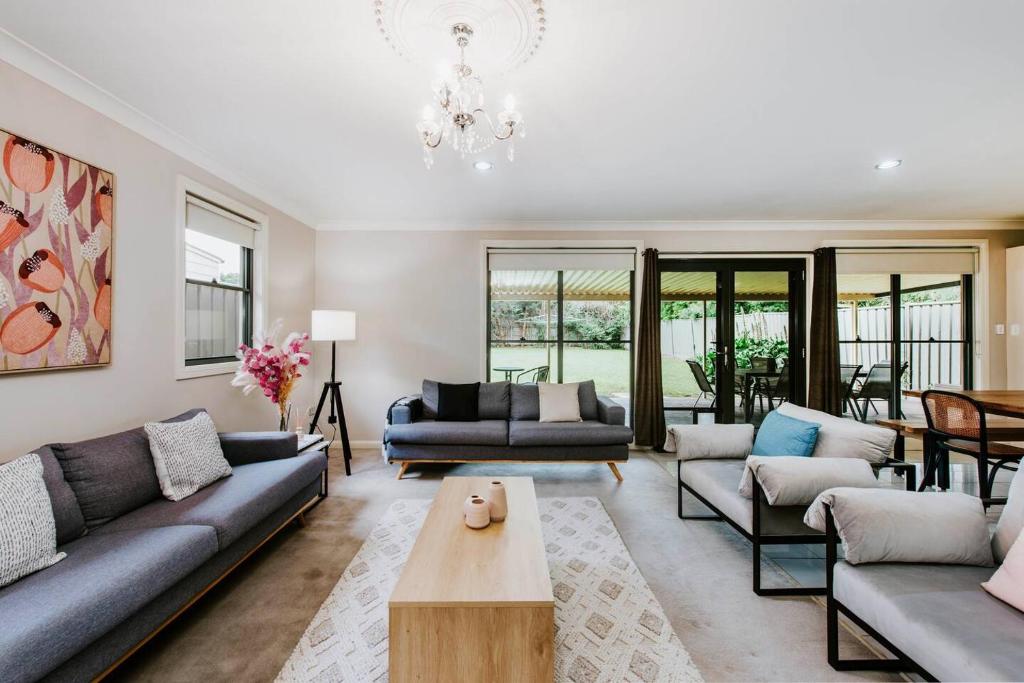 a living room with couches and a table at Gladstone Blush - Premium Comfort in Mudgee's Heart in Mudgee