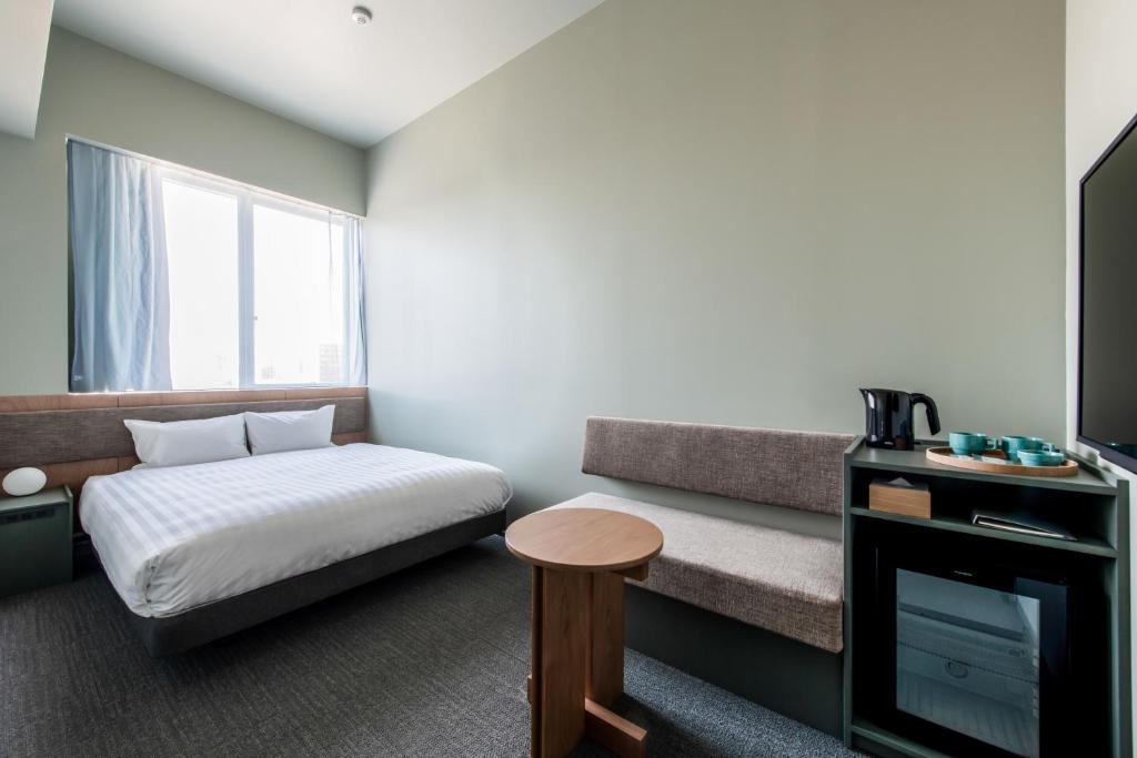 Postel nebo postele na pokoji v ubytování KAIKA Tokyo by THE SHARE HOTELS