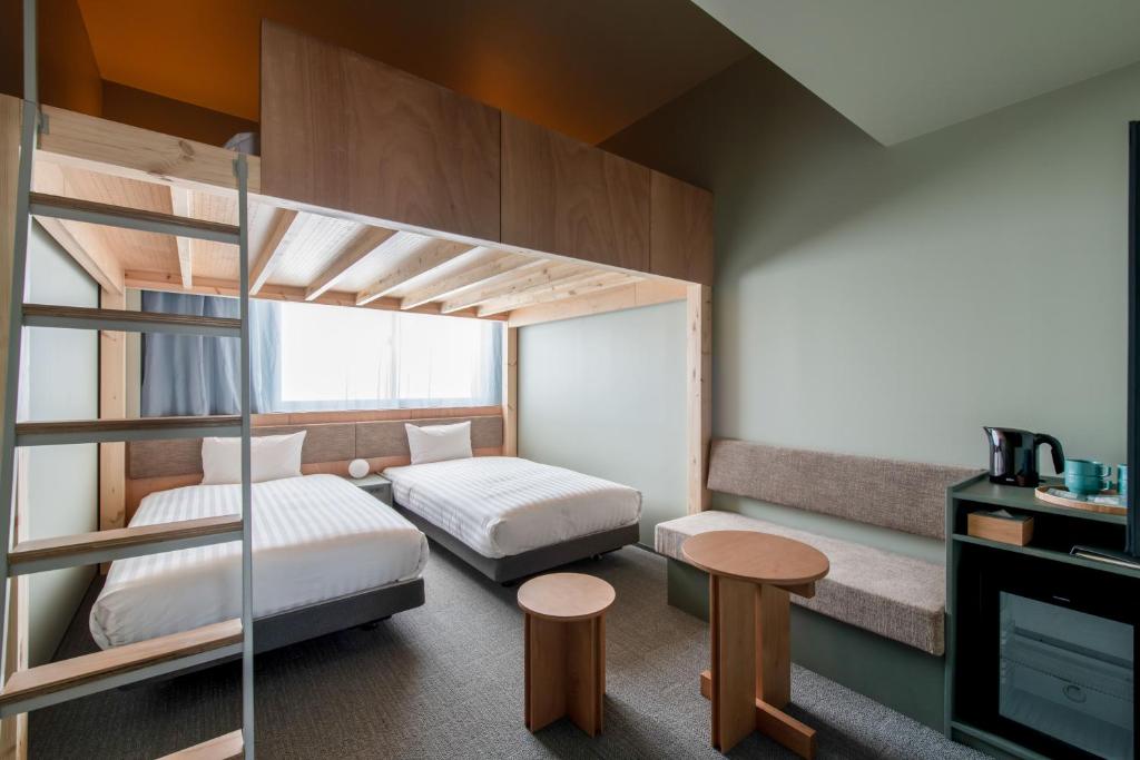 Postel nebo postele na pokoji v ubytování KAIKA Tokyo by THE SHARE HOTELS