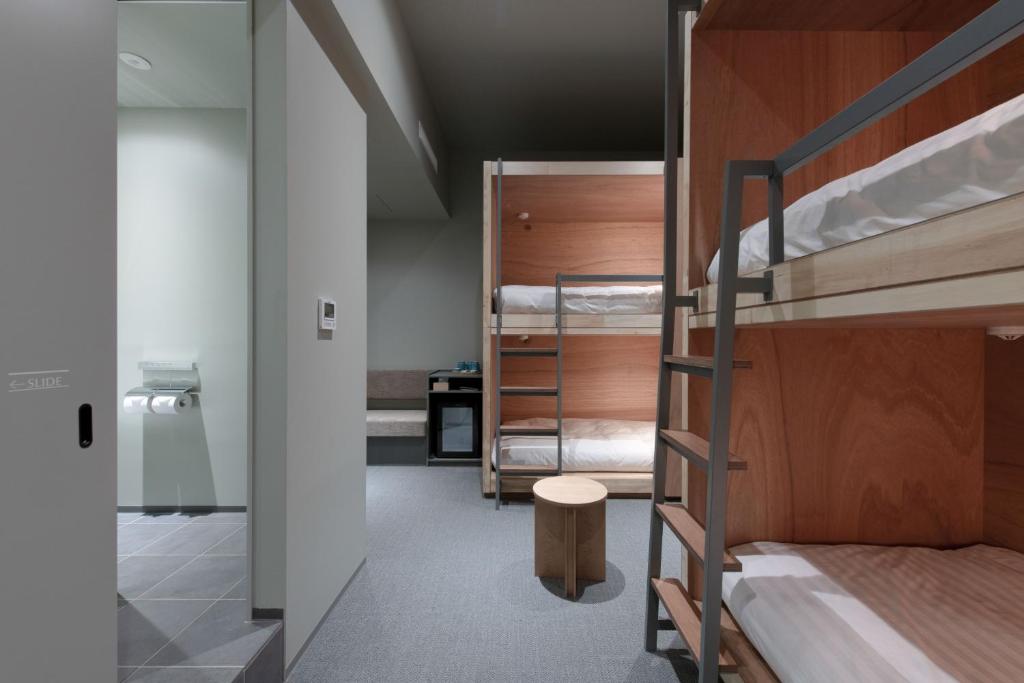 Postel nebo postele na pokoji v ubytování KAIKA Tokyo by THE SHARE HOTELS