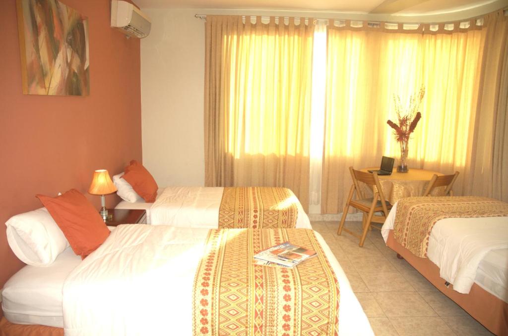 Postel nebo postele na pokoji v ubytování Hotel Air Suites