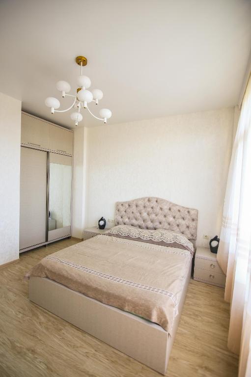 Llit o llits en una habitació de Мини - ГОСТИНИЦА "ЛЮБИМЫЙ ДОМ"