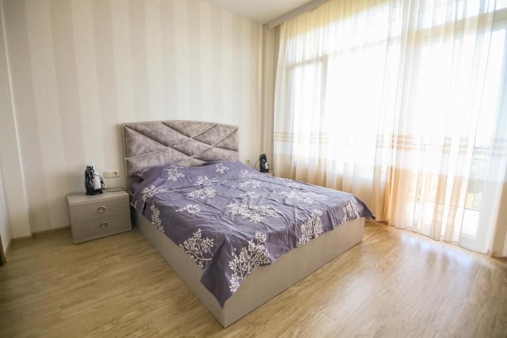 Llit o llits en una habitació de Мини - ГОСТИНИЦА "ЛЮБИМЫЙ ДОМ"