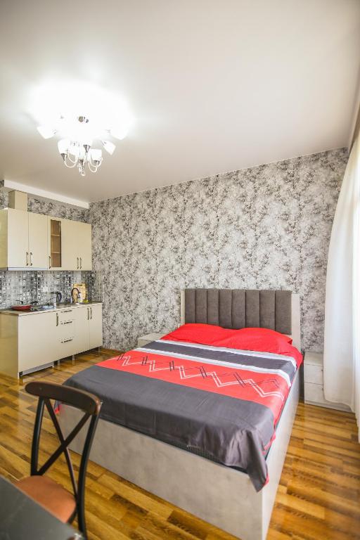 Llit o llits en una habitació de Мини - ГОСТИНИЦА "ЛЮБИМЫЙ ДОМ"