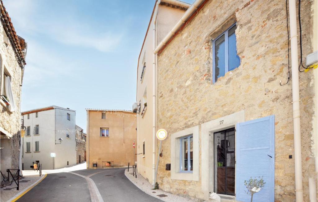 an alley in an old town with buildings at Beautiful Home In Villeseque Des Corbier With House A Panoramic View in Villesèque-des-Corbières