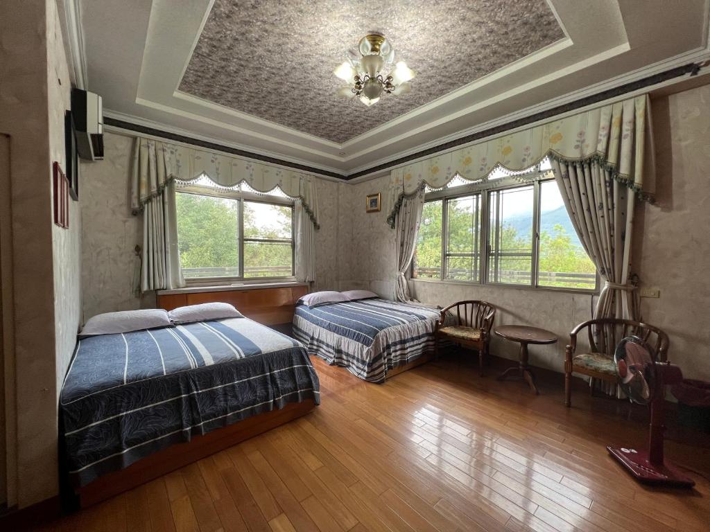 Postel nebo postele na pokoji v ubytování Ri Jing Yuan Homestay