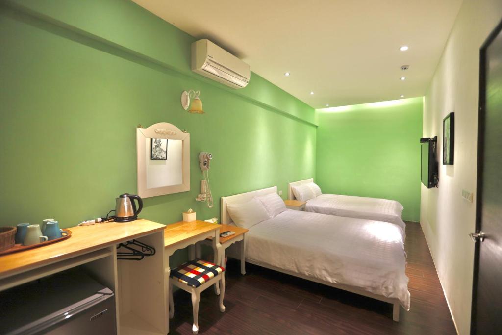 Cama o camas de una habitación en 好窩旅店