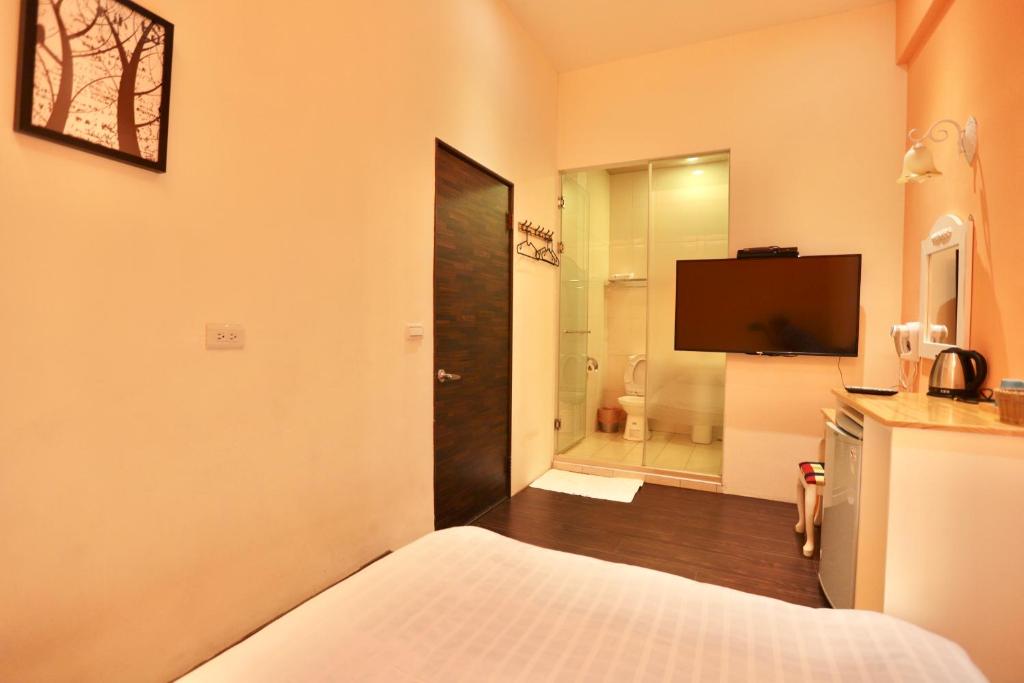 Cama o camas de una habitación en 好窩旅店