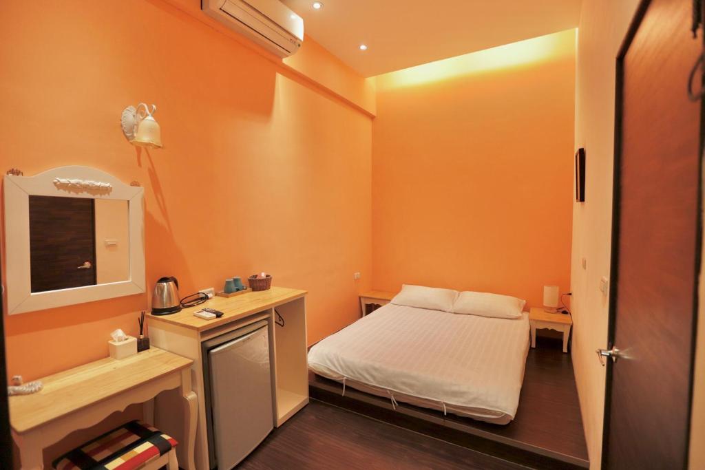 Cama o camas de una habitación en 好窩旅店
