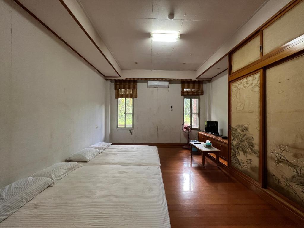 Postel nebo postele na pokoji v ubytování Ri Jing Yuan Homestay
