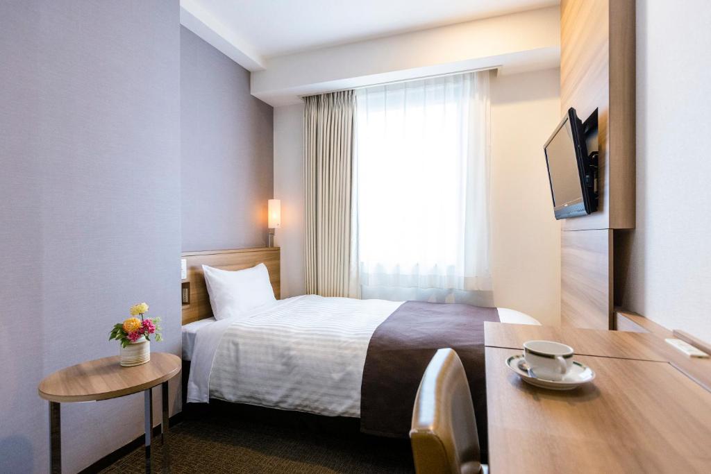 Postel nebo postele na pokoji v ubytování Choshi Plaza Hotel