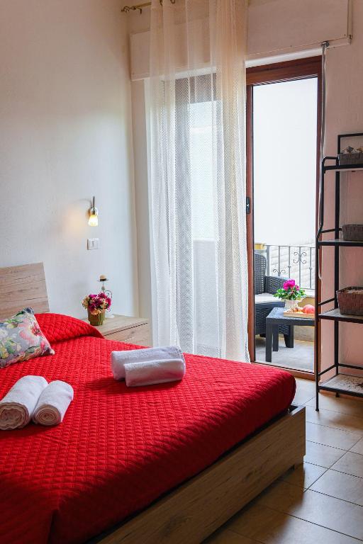 Postel nebo postele na pokoji v ubytování B&B I Gerani