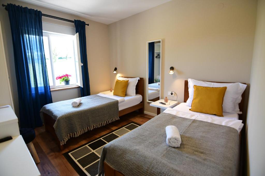 Posteľ alebo postele v izbe v ubytovaní Apartmani Zagi
