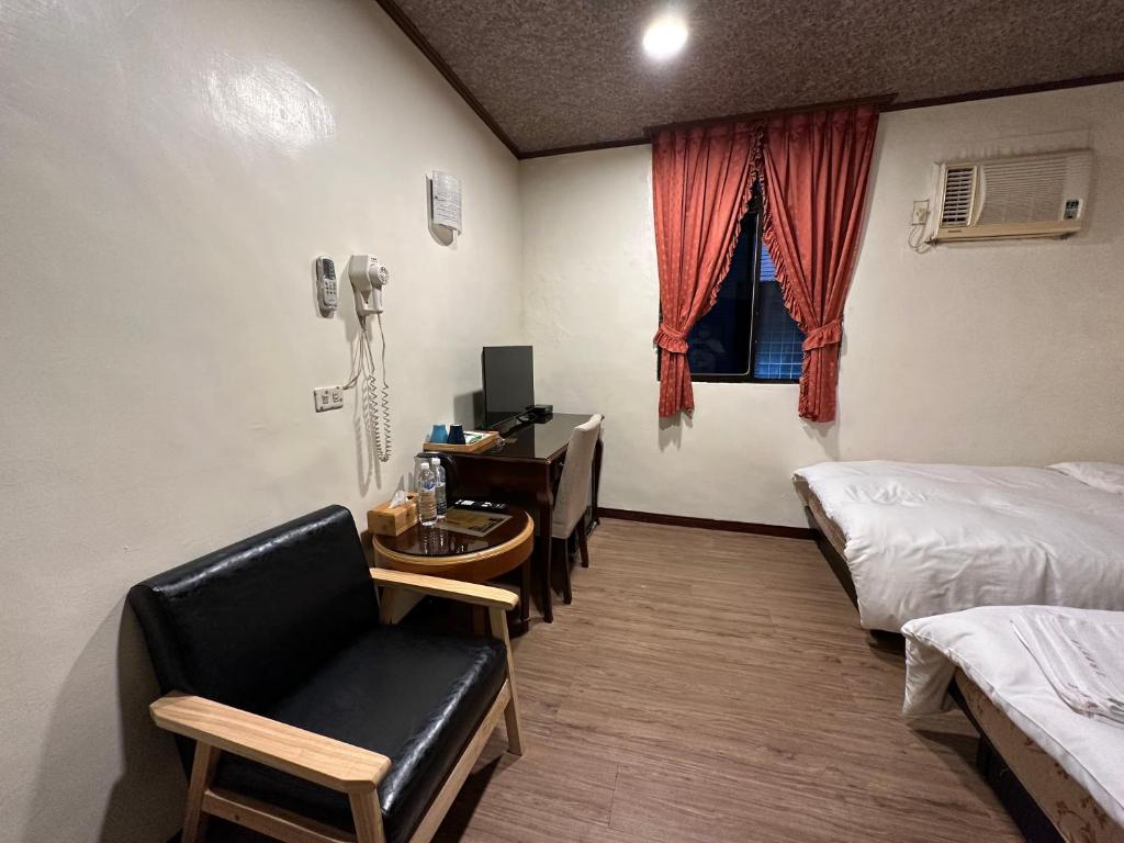 Postel nebo postele na pokoji v ubytování Ming Ren Hotspring Hotel