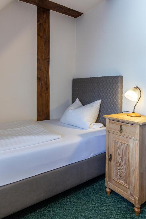 Postel nebo postele na pokoji v ubytování Hotel Meisnerhof
