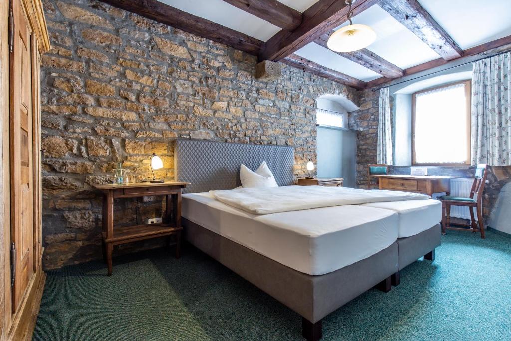 Postel nebo postele na pokoji v ubytování Hotel Meisnerhof