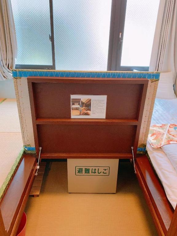 Postel nebo postele na pokoji v ubytování 無料wi-fi JING HOUSE 秋葉原 電動自転車レンタル