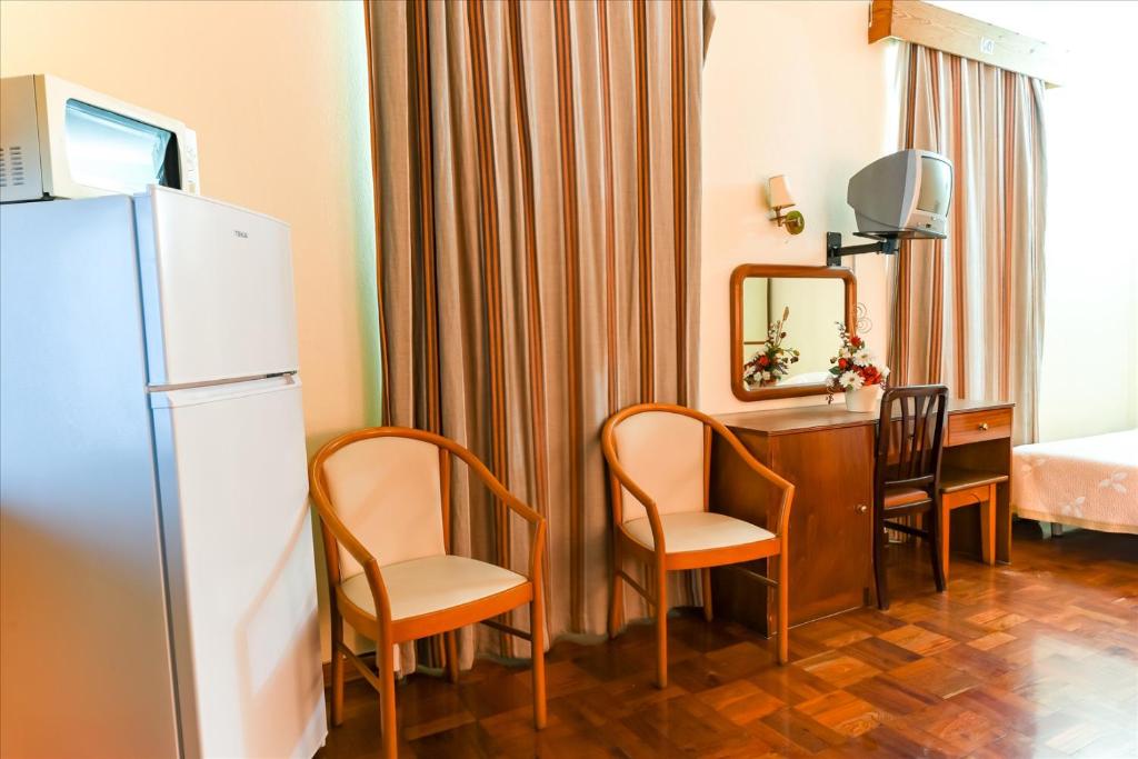 Postel nebo postele na pokoji v ubytování Residencial Colombo