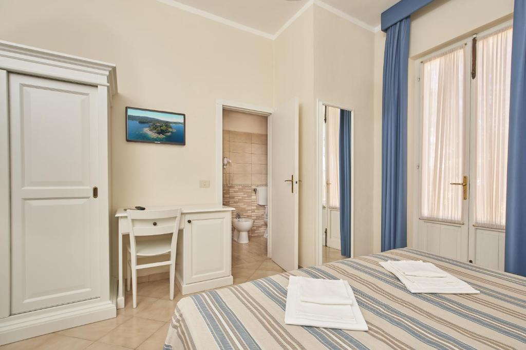 Postel nebo postele na pokoji v ubytování Hotel Villa Rodriguez