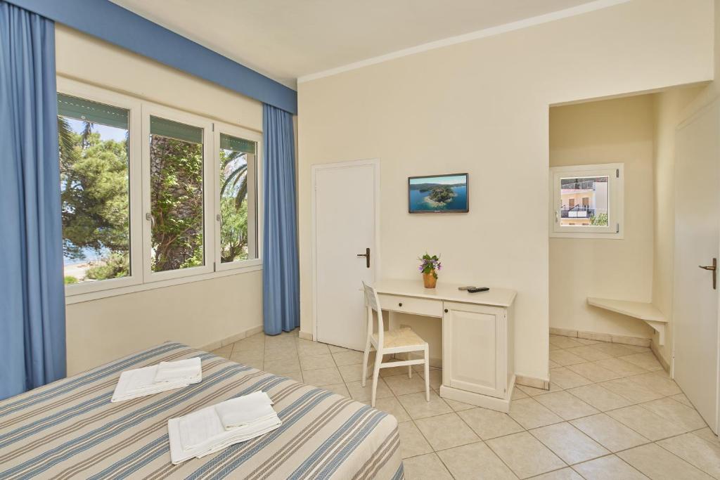 Postel nebo postele na pokoji v ubytování Hotel Villa Rodriguez