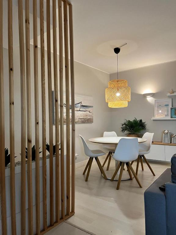 a dining room with a table and chairs at Saltwater Apartment in Portimão