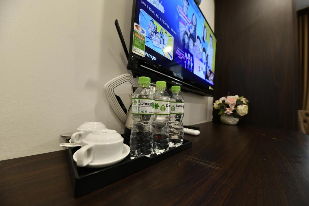 TV a/nebo společenská místnost v ubytování Kingdom Hotel Hanoi